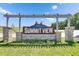 Stone entrance sign to Summit View community with blue sky background at 35260 Spruce Knob Ct, Dade City, FL 33525