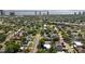 An elevated perspective reveals the house amidst mature trees, offering city views and convenient access to major routes at 3604 W El Prado Blvd, Tampa, FL 33629