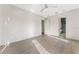 This bright bedroom boasts a modern ceiling fan, hardwood floors and an ensuite bathroom at 3604 W El Prado Blvd, Tampa, FL 33629