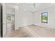 Bedroom with hardwood floors, a view of the hallway, and modern finishes at 3604 W El Prado Blvd, Tampa, FL 33629