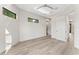 Well-lit bedroom with hardwood floors, modern windows, and neutral wall colors at 3604 W El Prado Blvd, Tampa, FL 33629