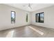 Bright bedroom with modern windows, light hardwood floors, and neutral decor at 3604 W El Prado Blvd, Tampa, FL 33629