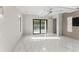 Modern bedroom with sliding glass doors to the outside pool area at 3604 W El Prado Blvd, Tampa, FL 33629