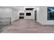 Upstairs bonus room featuring wood floors, an entertainment area, and plenty of natural light at 3604 W El Prado Blvd, Tampa, FL 33629