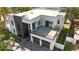 A modern two-story home with a rooftop patio above the garage, perfect for entertaining at 3604 W El Prado Blvd, Tampa, FL 33629