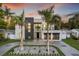 Modern home with striking architecture, manicured landscaping, and a welcoming driveway at 3604 W El Prado Blvd, Tampa, FL 33629