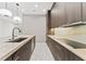 This sleek kitchen features marble countertops, modern lighting, and stainless steel appliances at 3604 W El Prado Blvd, Tampa, FL 33629