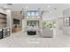 Bright and airy living room with marble floors, mini-bar, and large windows offers modern comfort at 3604 W El Prado Blvd, Tampa, FL 33629