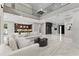 Stylish living room boasts marble floors, modern furnishings, and an open layout with sight lines to kitchen at 3604 W El Prado Blvd, Tampa, FL 33629