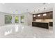 Open concept living area leading into kitchen, providing ideal flow at 3604 W El Prado Blvd, Tampa, FL 33629