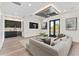 Modern living room with a wet bar, comfortable seating, and a stylish ceiling fan at 3604 W El Prado Blvd, Tampa, FL 33629