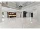 Open concept living room with high ceilings, marble floors, and modern finishes at 3604 W El Prado Blvd, Tampa, FL 33629