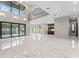 Bright and airy living room with a view of the pool and outdoor kitchen at 3604 W El Prado Blvd, Tampa, FL 33629