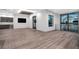 Modern living room featuring hardwood floors, a wet bar, and an abundance of natural light at 3604 W El Prado Blvd, Tampa, FL 33629