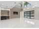 Bright living room with marble floors, mini-bar, and pool view offers modern comfort and style at 3604 W El Prado Blvd, Tampa, FL 33629