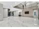 Spacious living room with sleek marble floors, a mini bar, and a unique wine cellar at 3604 W El Prado Blvd, Tampa, FL 33629