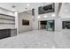Bright living room with marble floors, high ceilings, and a sleek bar area at 3604 W El Prado Blvd, Tampa, FL 33629