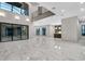 Open-concept living room boasts marble floors, high ceilings, and abundant natural light from large windows at 3604 W El Prado Blvd, Tampa, FL 33629