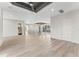Open living space featuring modern railings, tray ceiling, and abundant natural light at 3604 W El Prado Blvd, Tampa, FL 33629