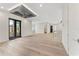 Expansive loft area featuring hardwood floors, custom ceiling and access to bedrooms at 3604 W El Prado Blvd, Tampa, FL 33629