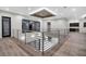 Loft with metal railing overlooks the lower level, providing natural light and views at 3604 W El Prado Blvd, Tampa, FL 33629