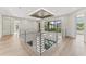 Open loft featuring modern railing and abundant natural light with view from upper level at 3604 W El Prado Blvd, Tampa, FL 33629