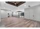 Open loft with hardwood floors, custom ceiling and a view to the bedrooms at 3604 W El Prado Blvd, Tampa, FL 33629