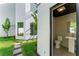 An outdoor restroom with clean lines and modern fixtures accessible from the backyard and pool area at 3604 W El Prado Blvd, Tampa, FL 33629