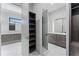 Walk-in closet with custom shelving, drawers, modern design and marble countertop at 3604 W El Prado Blvd, Tampa, FL 33629