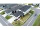 Well-manicured backyard with lush greenery and a modern white fence at 3706 Front Park Dr, Wesley Chapel, FL 33543