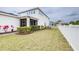 Well maintained backyard featuring lush green grass, manicured landscaping, and privacy fence at 3706 Front Park Dr, Wesley Chapel, FL 33543