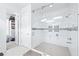 Modern bathroom featuring a glass shower, subway tile, and a decorative accent stripe at 3706 Front Park Dr, Wesley Chapel, FL 33543