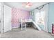 Charming bedroom with custom printed wall, loft bed and curtains for a whimsical retreat at 3706 Front Park Dr, Wesley Chapel, FL 33543