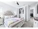 Bright bedroom featuring a decorative bed frame, and a closet with custom organizers at 3706 Front Park Dr, Wesley Chapel, FL 33543