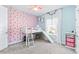 Charming bedroom with custom printed wall, loft bed and curtains for a whimsical retreat at 3706 Front Park Dr, Wesley Chapel, FL 33543