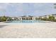 Large community pool area complete with pool house, lounge chairs, and splash pad at 3706 Front Park Dr, Wesley Chapel, FL 33543