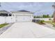 Spacious two car garage and driveway provide ample parking at 3706 Front Park Dr, Wesley Chapel, FL 33543