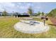 Community grilling area with picnic table and nearby seating surrounded by lush lawns at 3706 Front Park Dr, Wesley Chapel, FL 33543