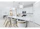 Bright kitchen features an island with quartz counters, pendant lighting and stainless steel appliances at 3706 Front Park Dr, Wesley Chapel, FL 33543