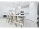 Bright kitchen featuring seating island, modern lighting, and stainless steel appliances at 3706 Front Park Dr, Wesley Chapel, FL 33543