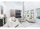 Bright living room with modern furniture, high ceilings and lots of natural light at 3706 Front Park Dr, Wesley Chapel, FL 33543