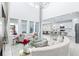 Spacious living room with great light, white couches, and open view to kitchen at 3706 Front Park Dr, Wesley Chapel, FL 33543
