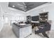 Upstairs living area featuring comfortable seating, entertainment center, and stylish decorations at 3706 Front Park Dr, Wesley Chapel, FL 33543