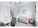 Stylish home office featuring a comfortable couch and adjacent french doors at 3706 Front Park Dr, Wesley Chapel, FL 33543