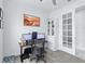 Bright office featuring carpeted floors, white trim, and double french doors at 3706 Front Park Dr, Wesley Chapel, FL 33543