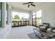 Relaxing screened porch with a comfortable seating area and view of the backyard at 3706 Front Park Dr, Wesley Chapel, FL 33543