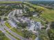 Overhead shot of a meticulously maintained golf course and clubhouse, surrounded by lush greenery and mature trees at 40 Gretchen Ct, Oldsmar, FL 34677