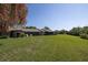 Wide backyard features a well-maintained lawn, perfect for outdoor activities at 40 Gretchen Ct, Oldsmar, FL 34677