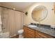 Bathroom featuring granite vanity with decorative mirror, bathtub and shower with curtain at 40 Gretchen Ct, Oldsmar, FL 34677