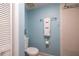 Cozy bathroom featuring a toilet, towel rack with towels, and shower with tiled walls at 40 Gretchen Ct, Oldsmar, FL 34677